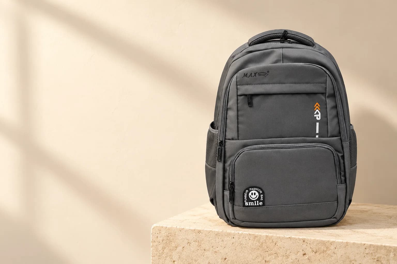 Everyday Backpack, Grey on a travertine block