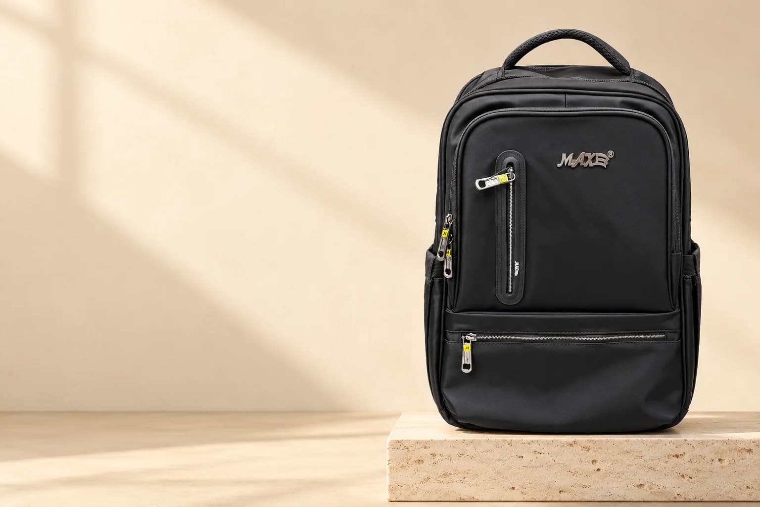 MAXE Slim Backpack on a travertine block